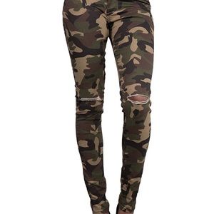 Skinny distressed camouflage jeans. Size 7